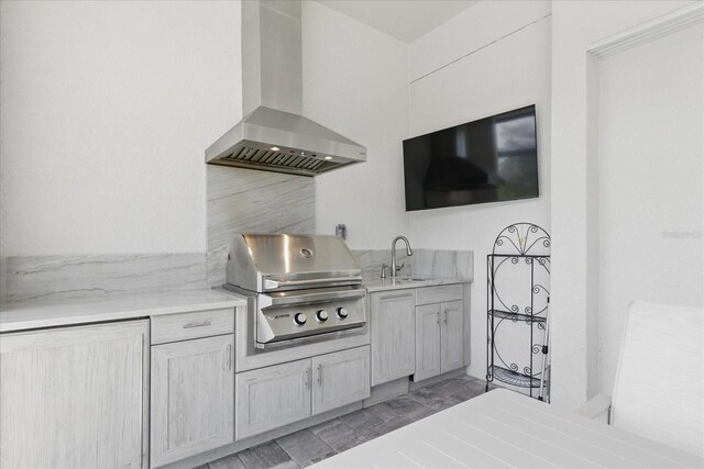 view of patio / terrace with a grill, a sink, and area for grilling