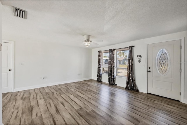 5755 Oxalis Rd, Venice, FL 34293 - entrance foyer featuring a ceiling fan, wood finished floors, and a textured ceiling