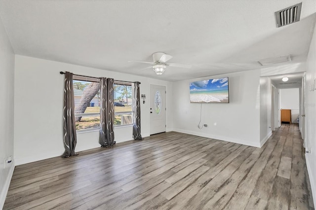 5755 Oxalis Rd, Venice, FL 34293 - spare room with a ceiling fan, wood finished floors, attic access, baseboards, and visible vents