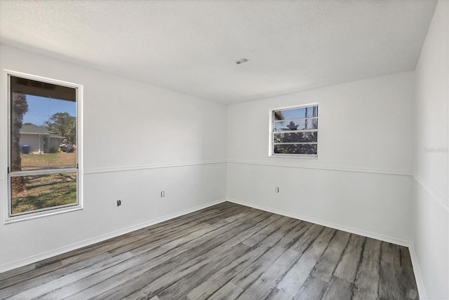 5755 Oxalis Rd, Venice, FL 34293 - empty room with baseboards and wood finished floors