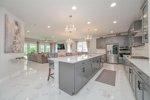 kitchen featuring recessed lighting, gray cabinets, visible vents, and appliances with stainless steel finishes
