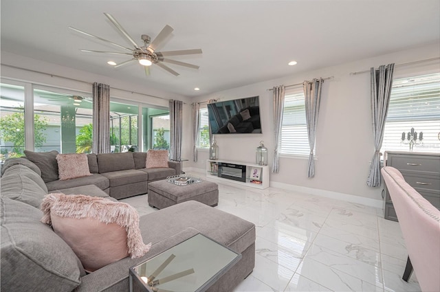 living area with baseboards, recessed lighting, marble finish floor, and a ceiling fan