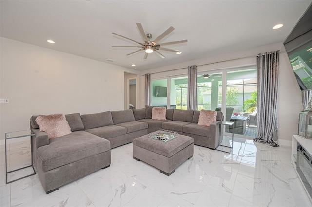 living room with recessed lighting, marble finish floor, and ceiling fan