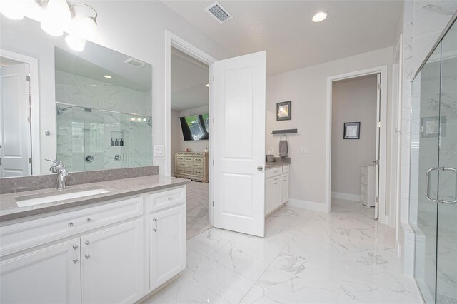 full bathroom featuring a marble finish shower, visible vents, recessed lighting, and vanity