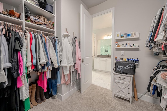 spacious closet with carpet flooring
