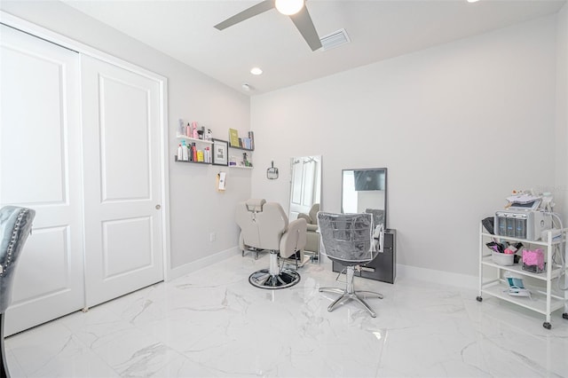 interior space with marble finish floor, ceiling fan, baseboards, and visible vents
