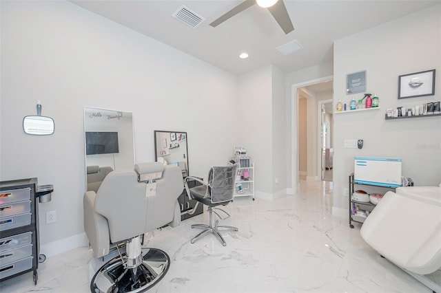 office with visible vents, baseboards, a ceiling fan, and marble finish floor
