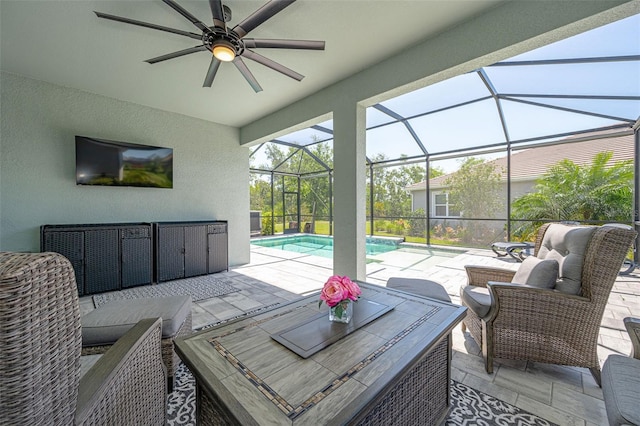 view of patio with an outdoor living space, an outdoor pool, ceiling fan, and glass enclosure