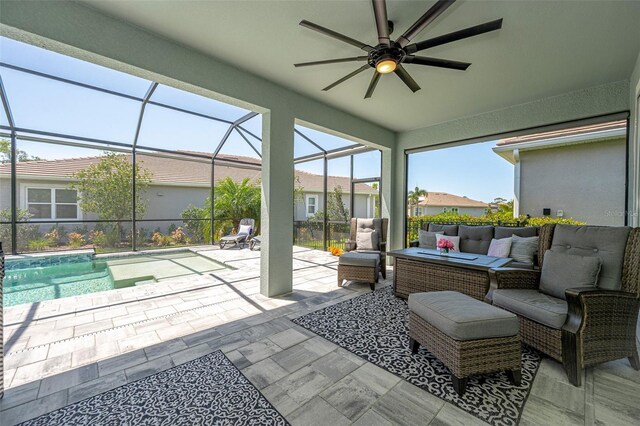 view of patio featuring an outdoor living space, an outdoor pool, glass enclosure, and a ceiling fan