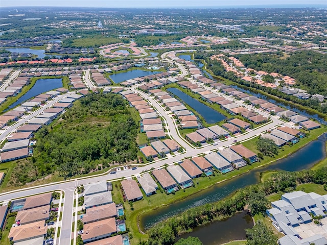 bird's eye view with a water view and a residential view