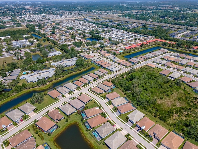 bird's eye view with a residential view and a water view