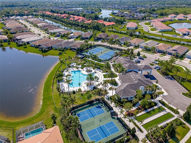drone / aerial view with a water view and a residential view
