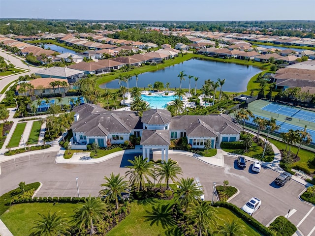 birds eye view of property with a water view and a residential view