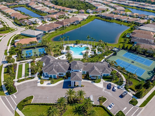 bird's eye view featuring a water view and a residential view