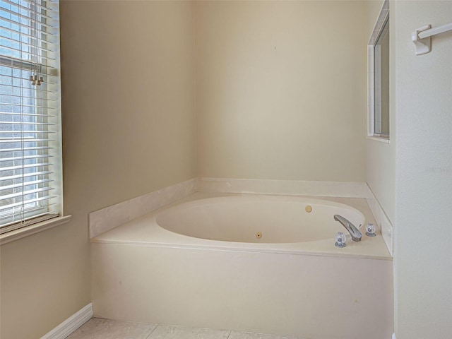 full bath with a bath and tile patterned flooring