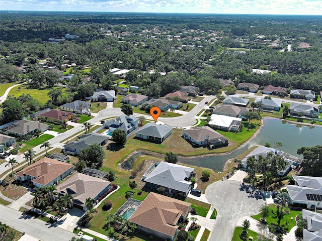 view of property location with nearby suburban area and a nearby body of water