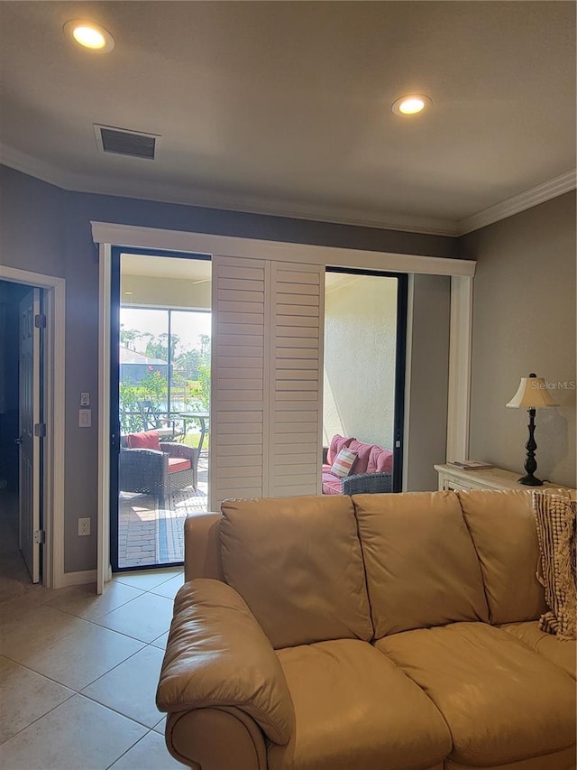 20188 Tesoro Dr, Venice, FL 34293 - living room featuring ornamental molding, light tile patterned floors, and recessed lighting