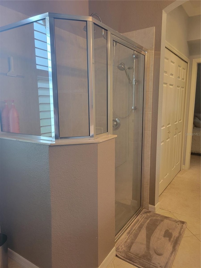20188 Tesoro Dr, Venice, FL 34293 - bathroom featuring a shower stall and tile patterned flooring