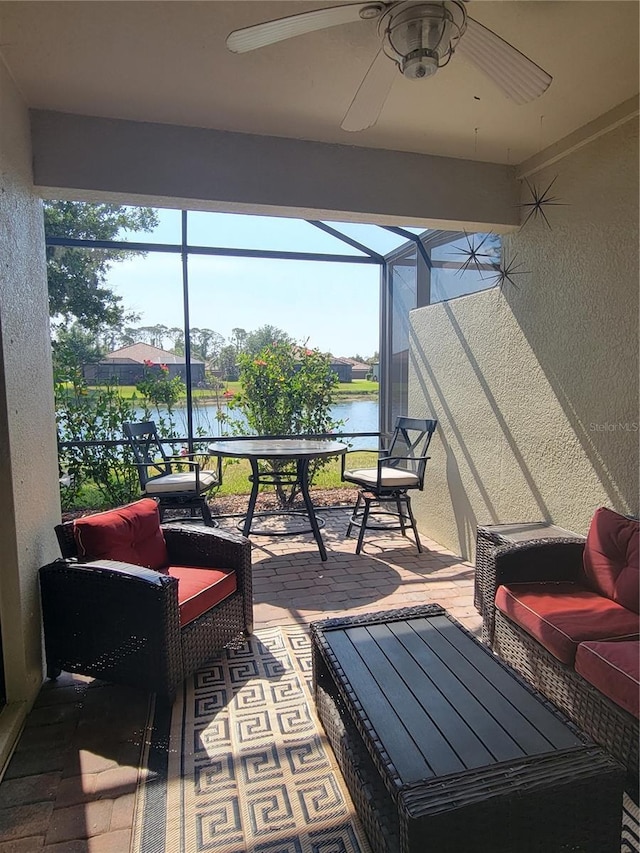 20188 Tesoro Dr, Venice, FL 34293 - sunroom / solarium featuring a water view, a ceiling fan, and plenty of natural light