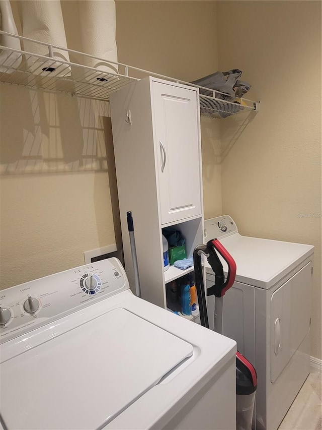 20188 Tesoro Dr, Venice, FL 34293 - laundry room featuring cabinet space and independent washer and dryer