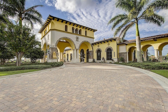 20188 Tesoro Dr, Venice, FL 34293 - mediterranean / spanish home featuring curved driveway and stucco siding