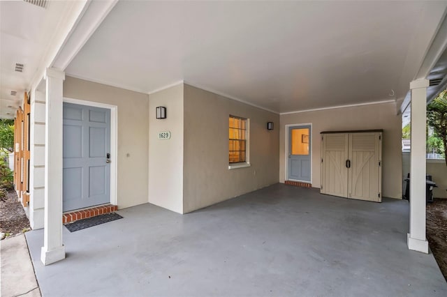 1629 Siesta Dr, Sarasota, FL 34239 - entrance to property featuring a carport, stucco siding, and visible vents