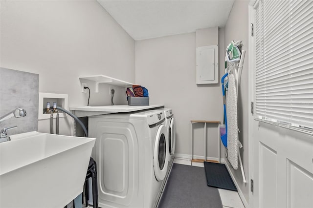 1629 Siesta Dr, Sarasota, FL 34239 - washroom featuring baseboards, electric panel, independent washer and dryer, laundry area, and a sink