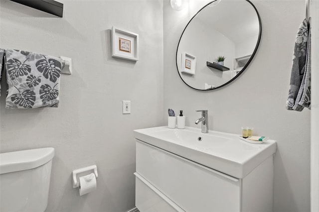 1629 Siesta Dr, Sarasota, FL 34239 - half bathroom featuring vanity and toilet
