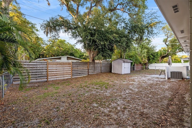 1629 Siesta Dr, Sarasota, FL 34239 - view of yard with a fenced backyard, a shed, an outdoor structure, and central AC