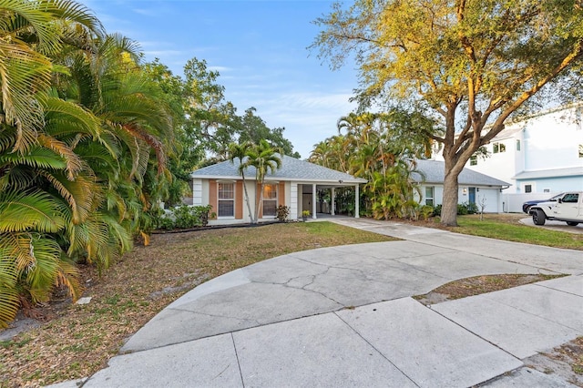 1629 Siesta Dr, Sarasota, FL 34239 - view of front of home featuring an attached carport and driveway