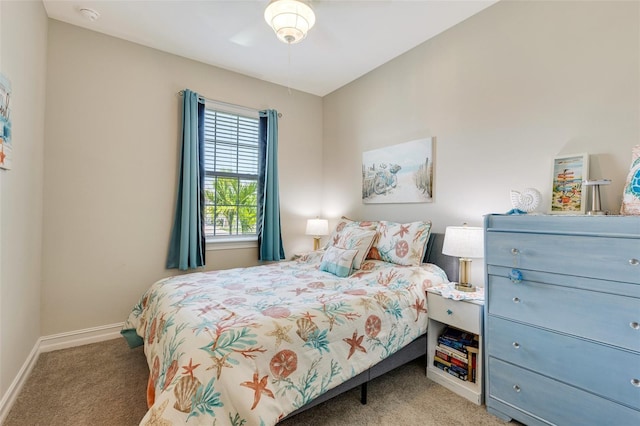 carpeted bedroom featuring baseboards