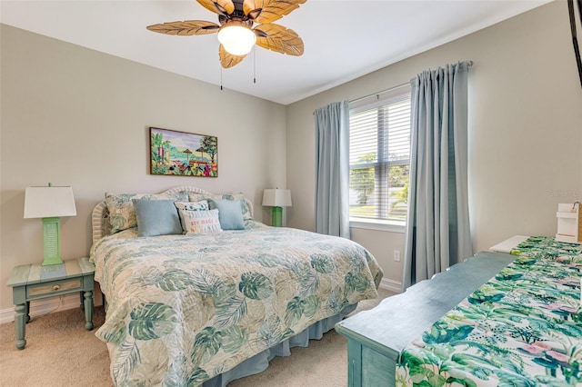 carpeted bedroom with baseboards and ceiling fan