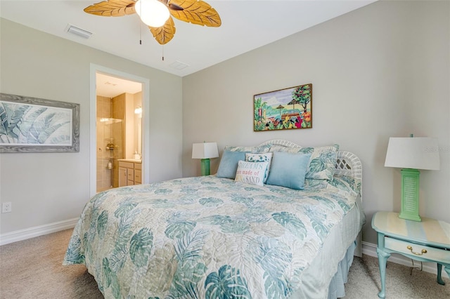 bedroom featuring carpet flooring, baseboards, ensuite bath, and ceiling fan