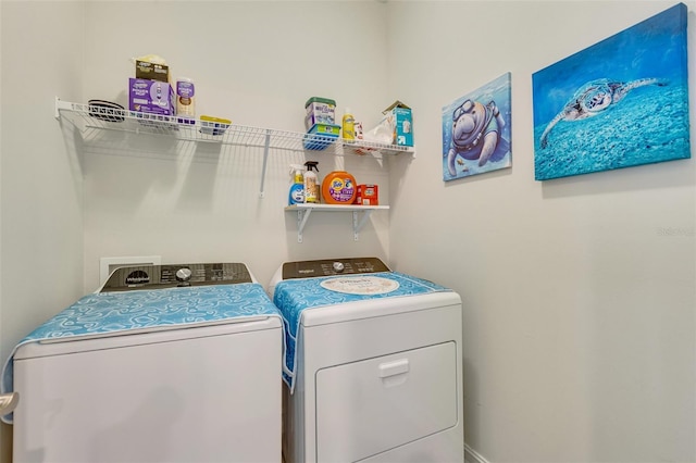washroom featuring washer and clothes dryer