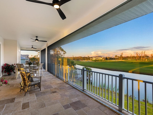9810 Eagle Preserve Dr, Englewood, FL 34224 - balcony featuring a water view, a ceiling fan, and golf course view