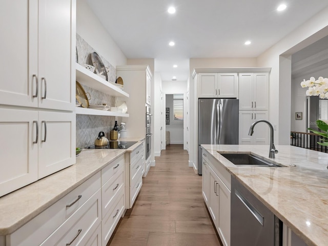 9810 Eagle Preserve Dr, Englewood, FL 34224 - kitchen with a sink, appliances with stainless steel finishes, open shelves, and recessed lighting