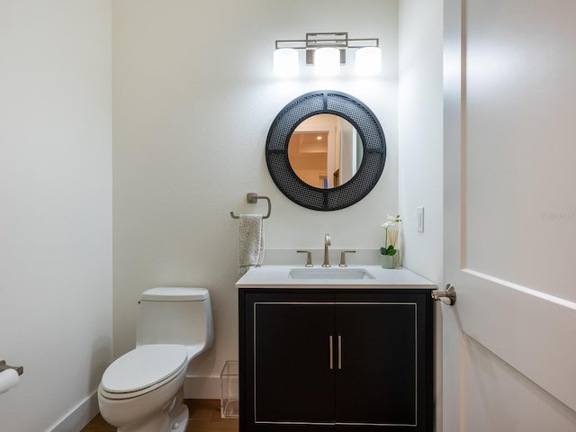 9810 Eagle Preserve Dr, Englewood, FL 34224 - half bathroom featuring vanity, baseboards, and toilet