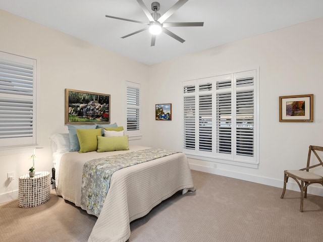 9810 Eagle Preserve Dr, Englewood, FL 34224 - carpeted bedroom with baseboards and ceiling fan