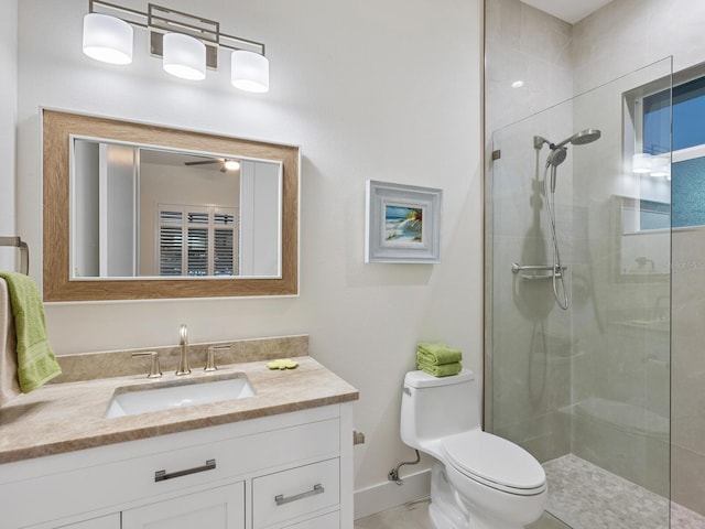 9810 Eagle Preserve Dr, Englewood, FL 34224 - full bathroom featuring vanity, baseboards, toilet, and tiled shower