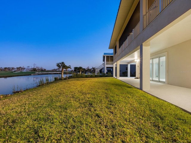 9810 Eagle Preserve Dr, Englewood, FL 34224 - view of yard featuring a patio and a water view