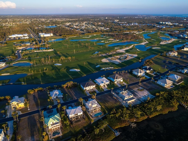 9810 Eagle Preserve Dr, Englewood, FL 34224 - bird's eye view with a water view, view of golf course, and a residential view