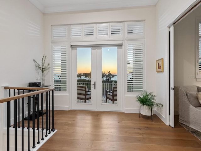 9810 Eagle Preserve Dr, Englewood, FL 34224 - doorway to outside with crown molding, baseboards, french doors, and hardwood / wood-style flooring