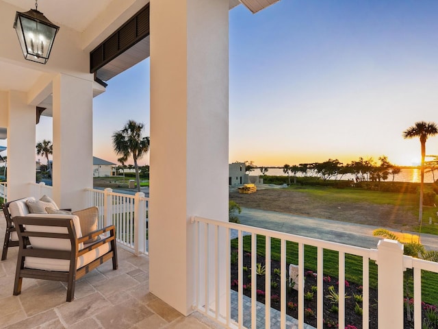 9810 Eagle Preserve Dr, Englewood, FL 34224 - balcony at dusk with a porch