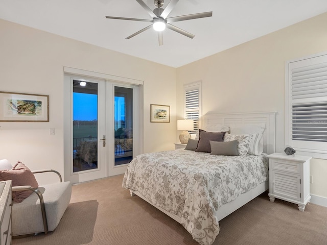 9810 Eagle Preserve Dr, Englewood, FL 34224 - bedroom featuring a ceiling fan, light colored carpet, and access to exterior