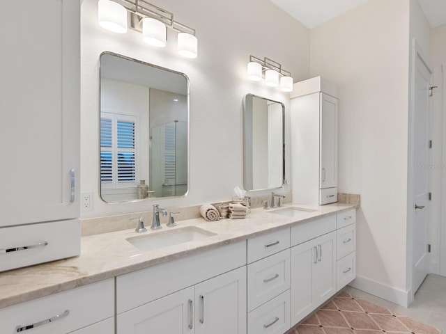 9810 Eagle Preserve Dr, Englewood, FL 34224 - bathroom with an enclosed shower, double vanity, a sink, and tile patterned flooring