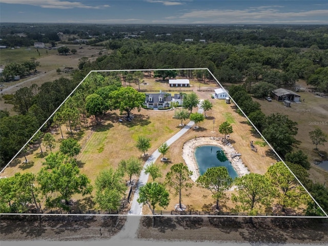 6824 283rd St E, Myakka City, FL 34251 - aerial overview of property's location featuring property parcel outlined, a large body of water, and a heavily wooded area