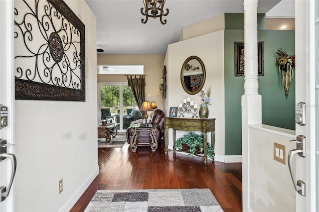 6824 283rd St E, Myakka City, FL 34251 - foyer featuring wood finished floors, baseboards, and ornate columns