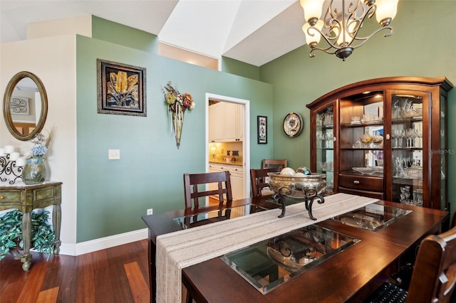 6824 283rd St E, Myakka City, FL 34251 - dining area featuring a chandelier, wood finished floors, and baseboards