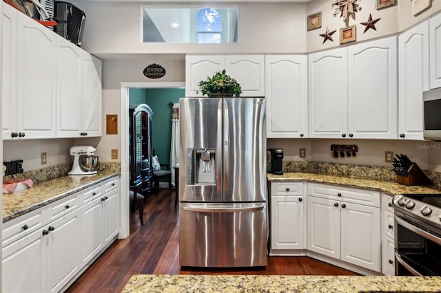 6824 283rd St E, Myakka City, FL 34251 - kitchen with stainless steel appliances, light stone counters, and white cabinets