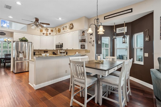 6824 283rd St E, Myakka City, FL 34251 - dining space with a chandelier, dark wood-type flooring, a ceiling fan, recessed lighting, and baseboards